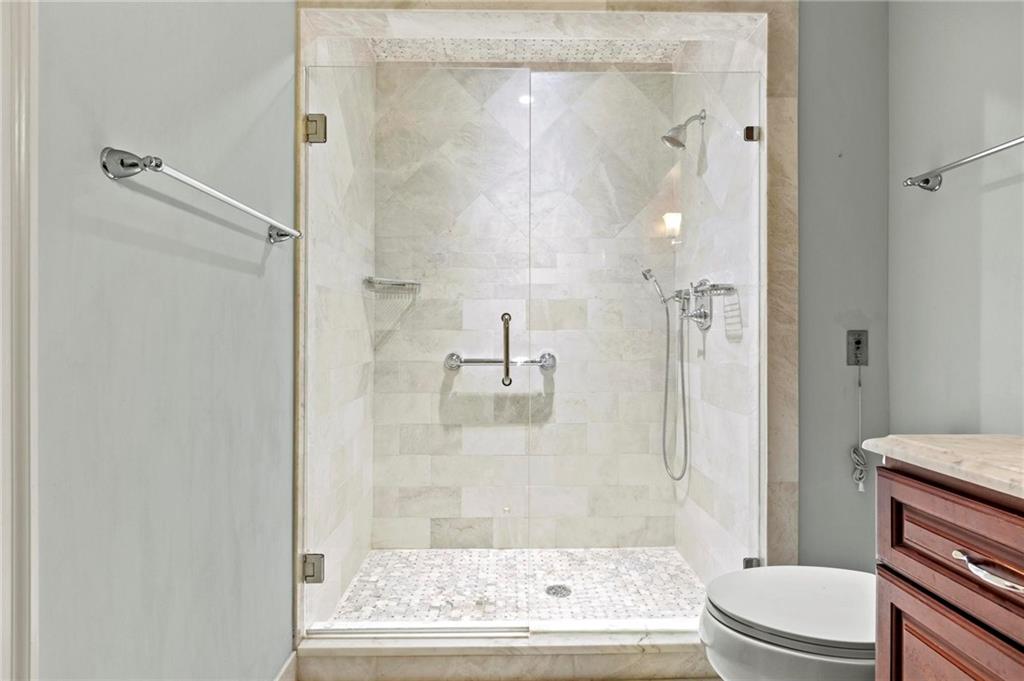 300 Johnson Ferry Road, Unit A110 Atlanta, GA 30328 - Photo 17 of 27 a bathroom with a granite countertop bathtub shower and toilet
