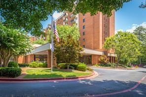 300 Johnson Ferry Road, Unit A110 Atlanta, GA 30328 - Photo 19 of 27 a front view of a house with a yard and trees