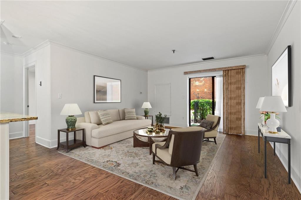300 Johnson Ferry Road, Unit A110 Atlanta, GA 30328 - Photo 2 of 27 a living room with furniture a large window and wooden floor