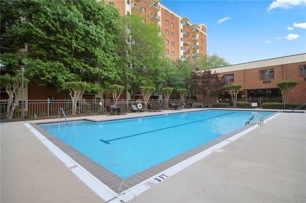 300 Johnson Ferry Road, Unit A110 Atlanta, GA 30328 - Photo 22 of 27 a view of a house with a swimming pool