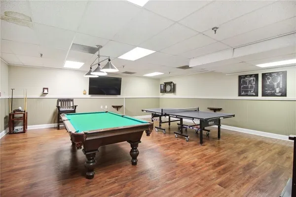a room with furniture and pool table