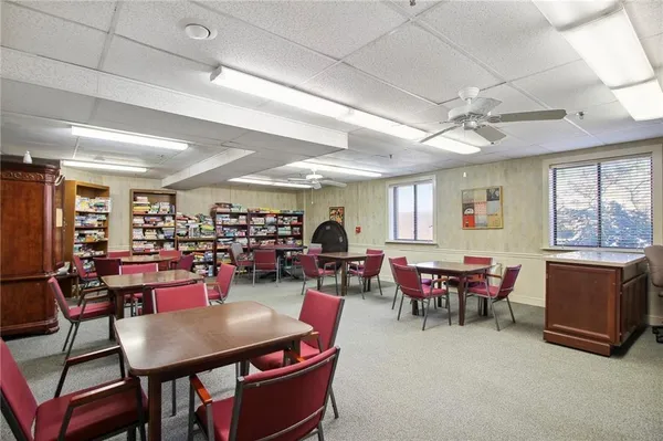 a view of a dining room with furniture window and outside view