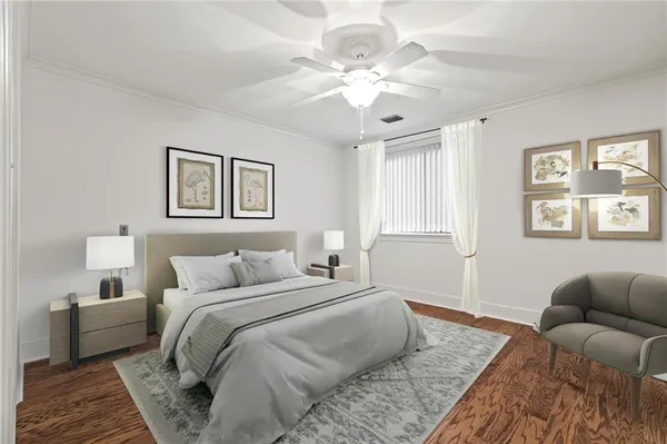 a bedroom with a large bed and a couch