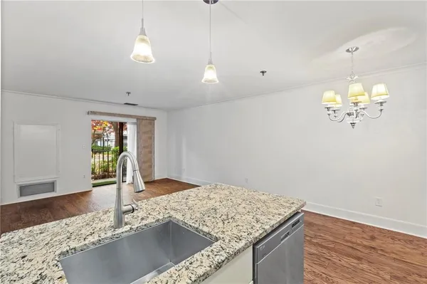 a view of a kitchen with marble kitchen and kitchen counter top space