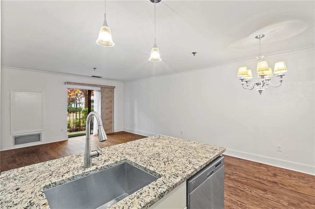 300 Johnson Ferry Road, Unit A110 Atlanta, GA 30328 - Photo 7 of 27 a view of a kitchen with marble kitchen and kitchen counter top space