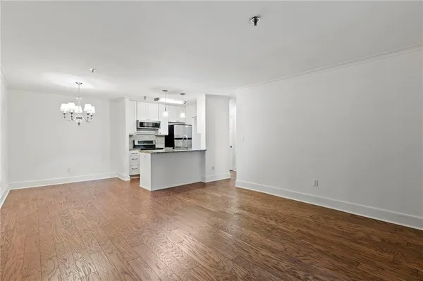 a view of kitchen with wooden floor