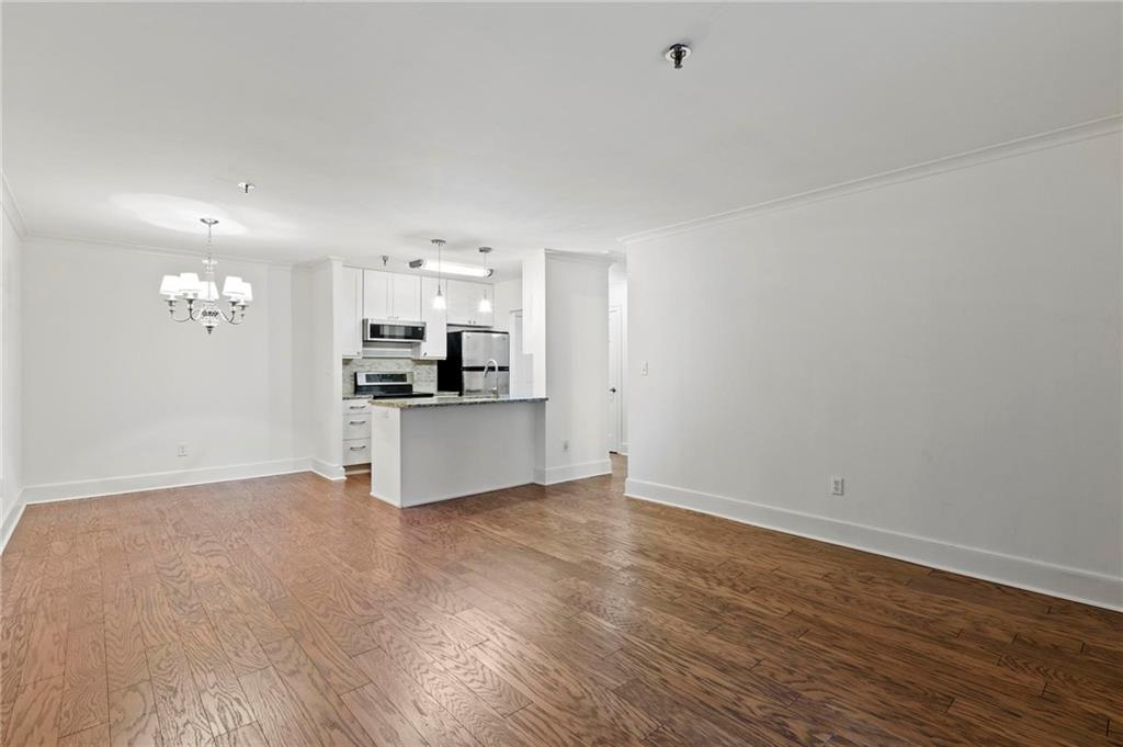 300 Johnson Ferry Road, Unit A110 Atlanta, GA 30328 - Photo 9 of 27 a view of kitchen with wooden floor