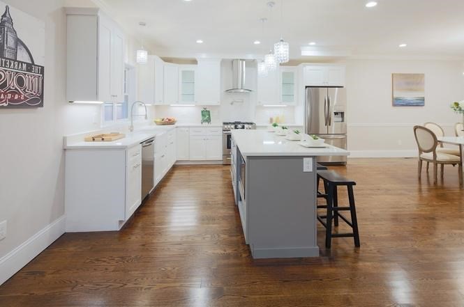 93 Calvary Street, Unit 2 Waltham, MA 02453 - Photo 13 of 33 a kitchen with appliances and cabinets