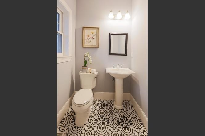 93 Calvary Street, Unit 2 Waltham, MA 02453 - Photo 20 of 33 a white toilet sitting next to a bathroom sink
