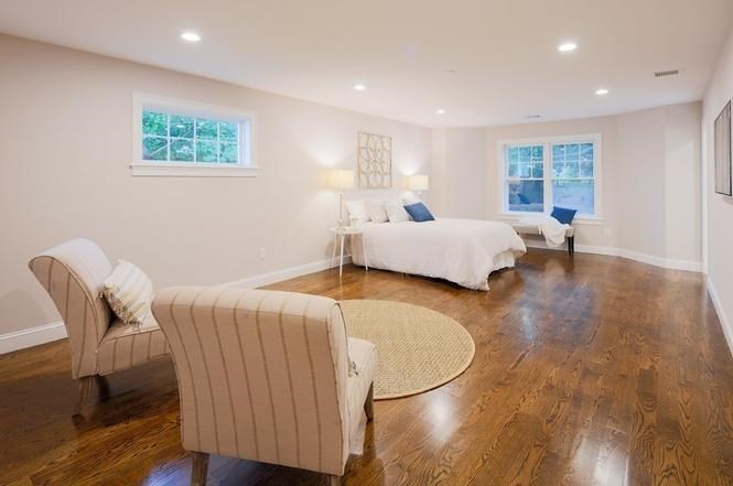 93 Calvary Street, Unit 2 Waltham, MA 02453 - Photo 23 of 33 a spacious bedroom with a bed and a window