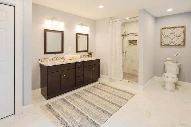 93 Calvary Street, Unit 2 Waltham, MA 02453 - Photo 24 of 33 a spacious bathroom with a bathtub sink mirror and toilet