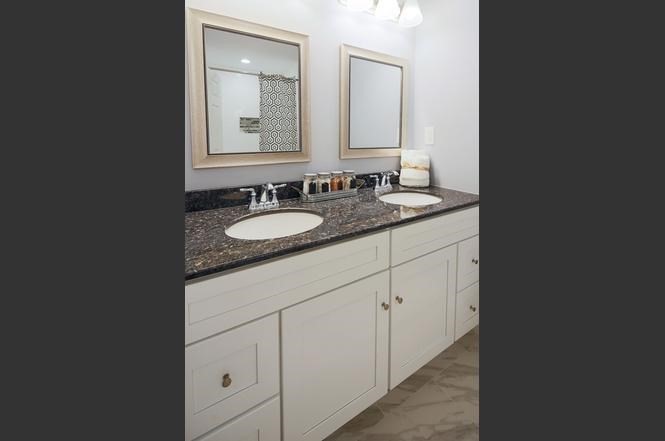 93 Calvary Street, Unit 2 Waltham, MA 02453 - Photo 29 of 33 a bathroom with a sink and a mirror