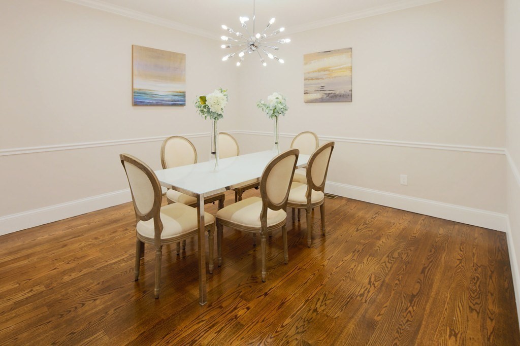 93 Calvary Street, Unit 2 Waltham, MA 02453 - Photo 3 of 33 a view of a dining room with furniture and wooden floor