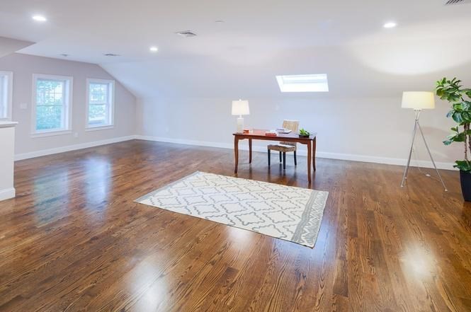 93 Calvary Street, Unit 2 Waltham, MA 02453 - Photo 31 of 33 a living room with hard wood floors and a wooden floor