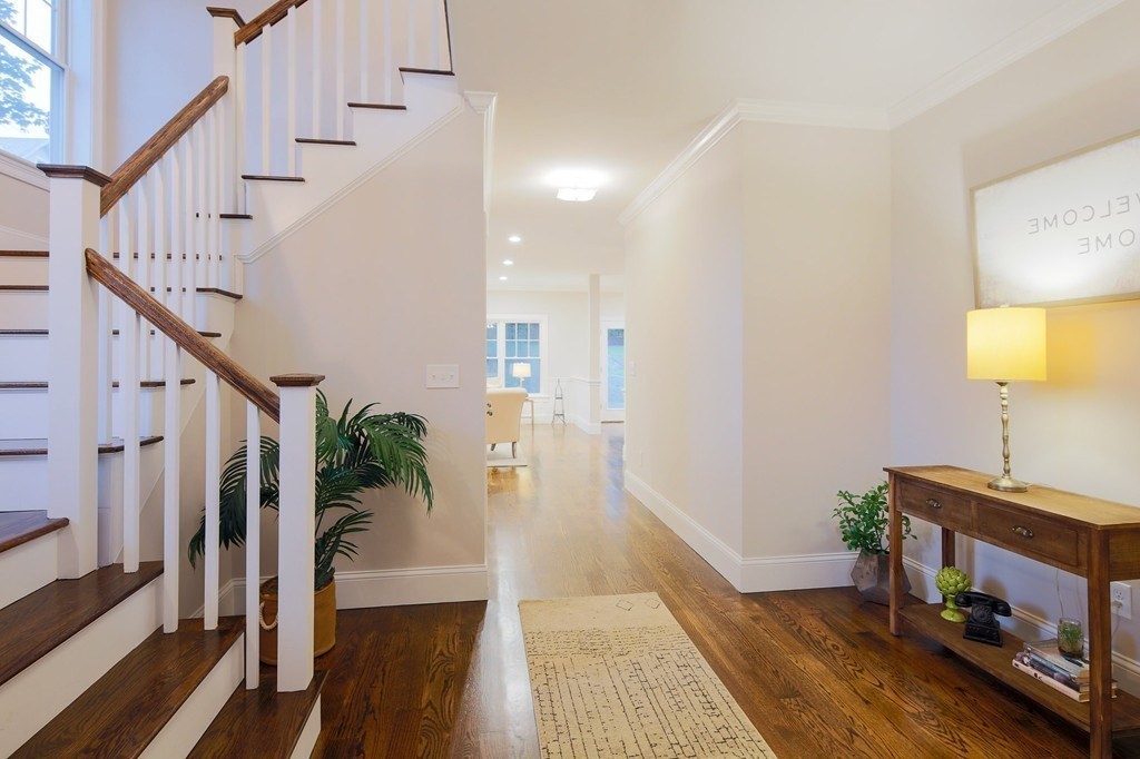 93 Calvary Street, Unit 2 Waltham, MA 02453 - Photo 5 of 33 a view of entryway and hall with wooden floor