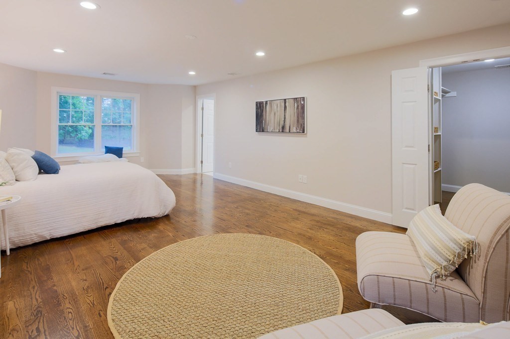 93 Calvary Street, Unit 2 Waltham, MA 02453 - Photo 6 of 33 a bedroom with two beds and a couch