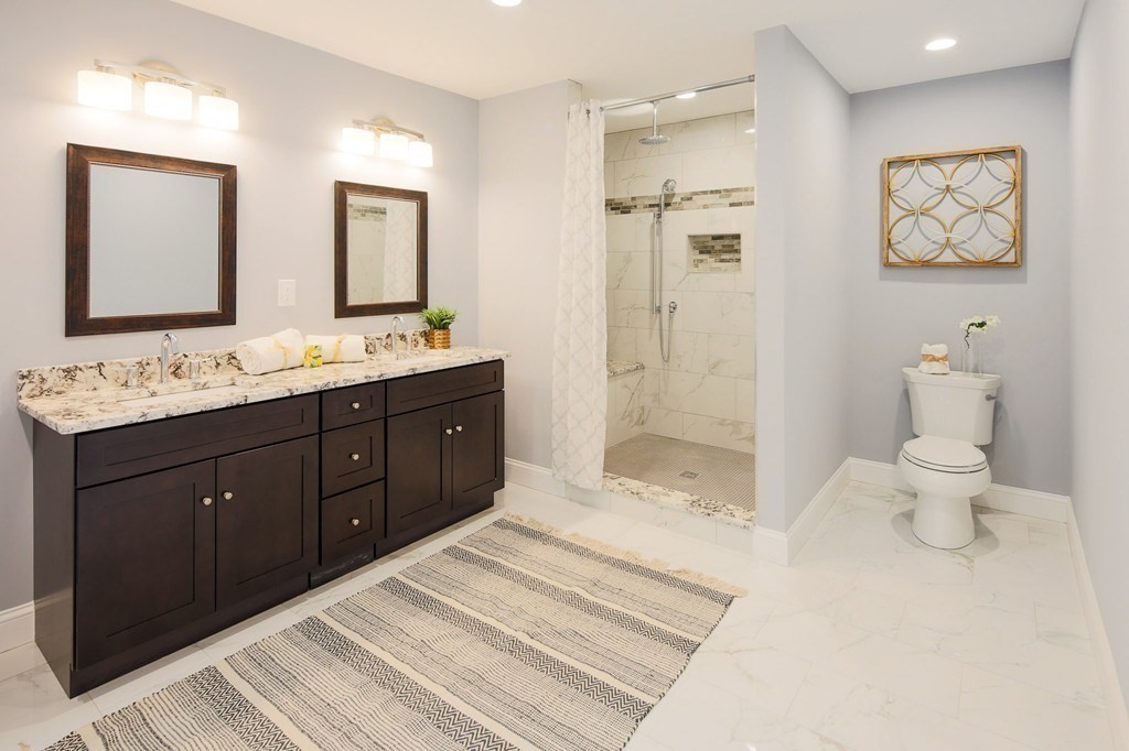 93 Calvary Street, Unit 2 Waltham, MA 02453 - Photo 7 of 33 a spacious bathroom with a double vanity sink mirror and double