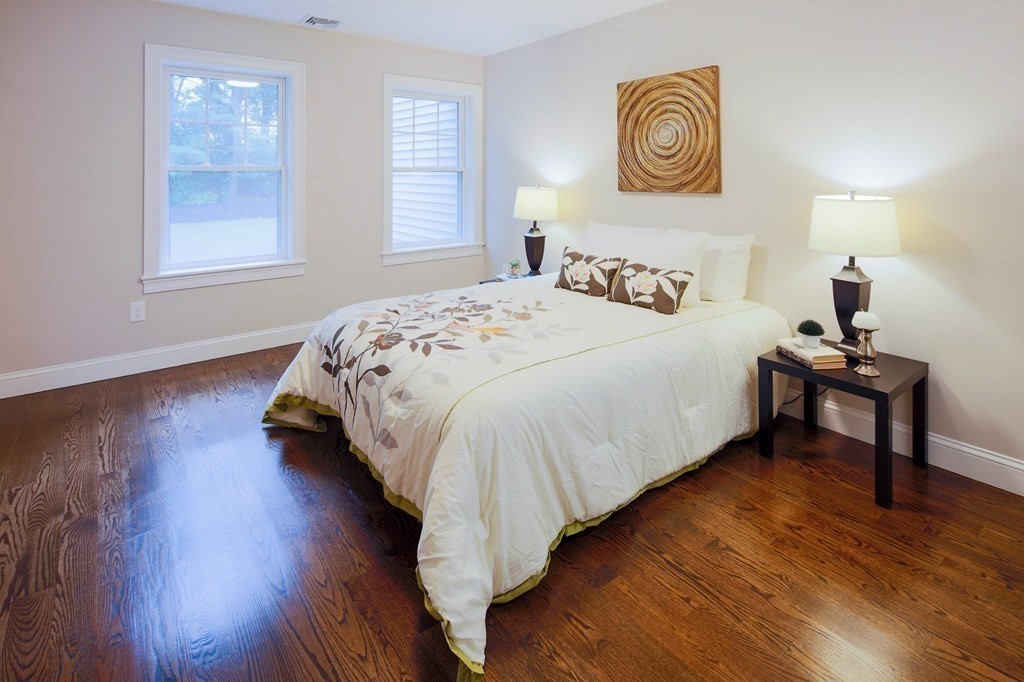 93 Calvary Street, Unit 2 Waltham, MA 02453 - Photo 8 of 33 a bedroom with bed and a window