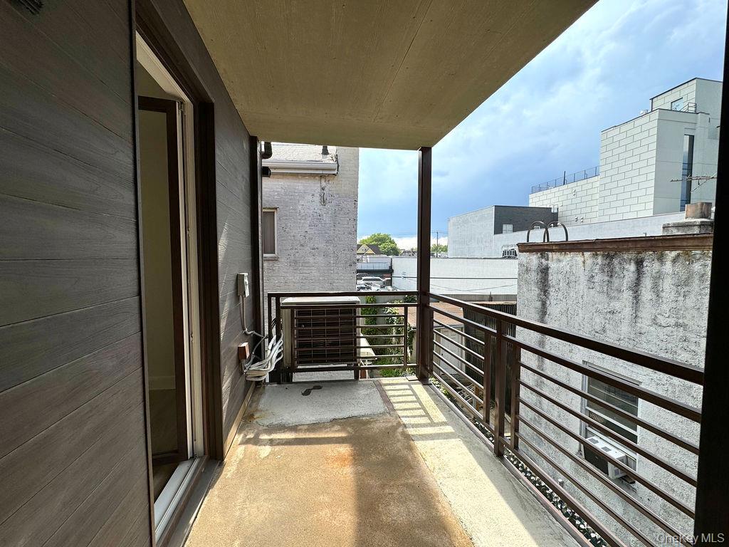 2478 East 11th Street, Unit 2C Brooklyn, NY 11235 - Photo 14 of 16 a view of balcony with couch