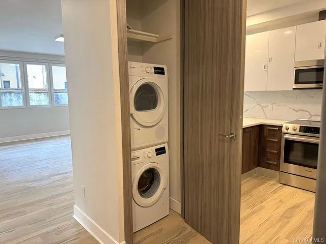 a view of a kitchen with washer and dryer