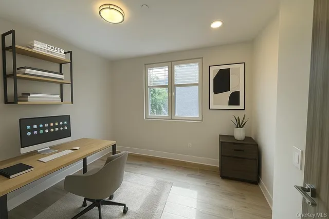 a workspace with furniture and window