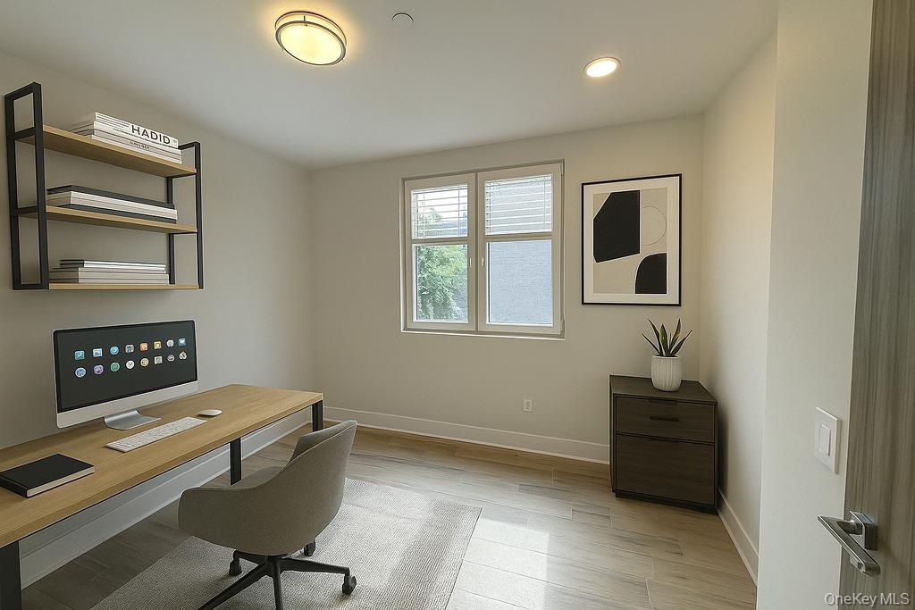 2478 East 11th Street, Unit 2C Brooklyn, NY 11235 - Photo 4 of 16 a workspace with furniture and window