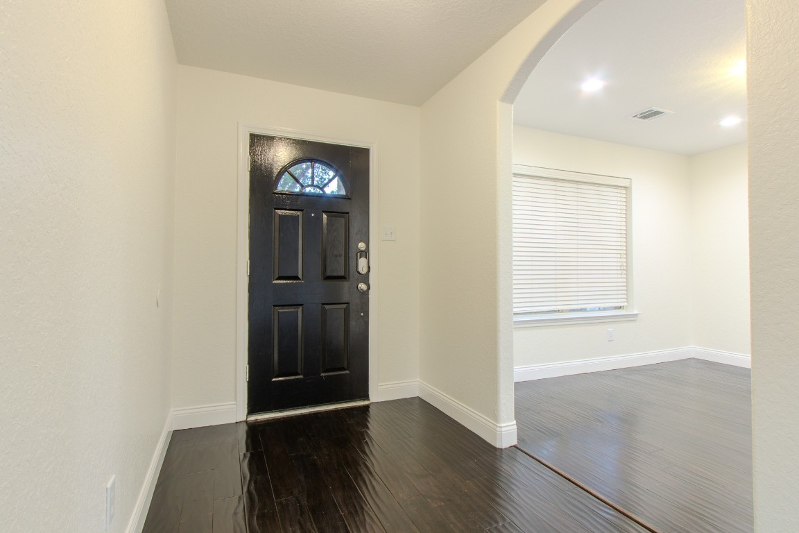 21906 Trapper Lake Drive Spring, TX 77388 - Photo 4 of 21 You're welcomed into a formal foyer and a home office off the entry with a front-facing window.