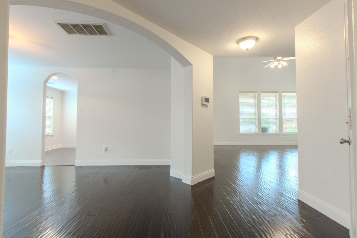 21906 Trapper Lake Drive Spring, TX 77388 - Photo 5 of 21 Stepping further into the home, the architectural detail elevates the formal dining area.