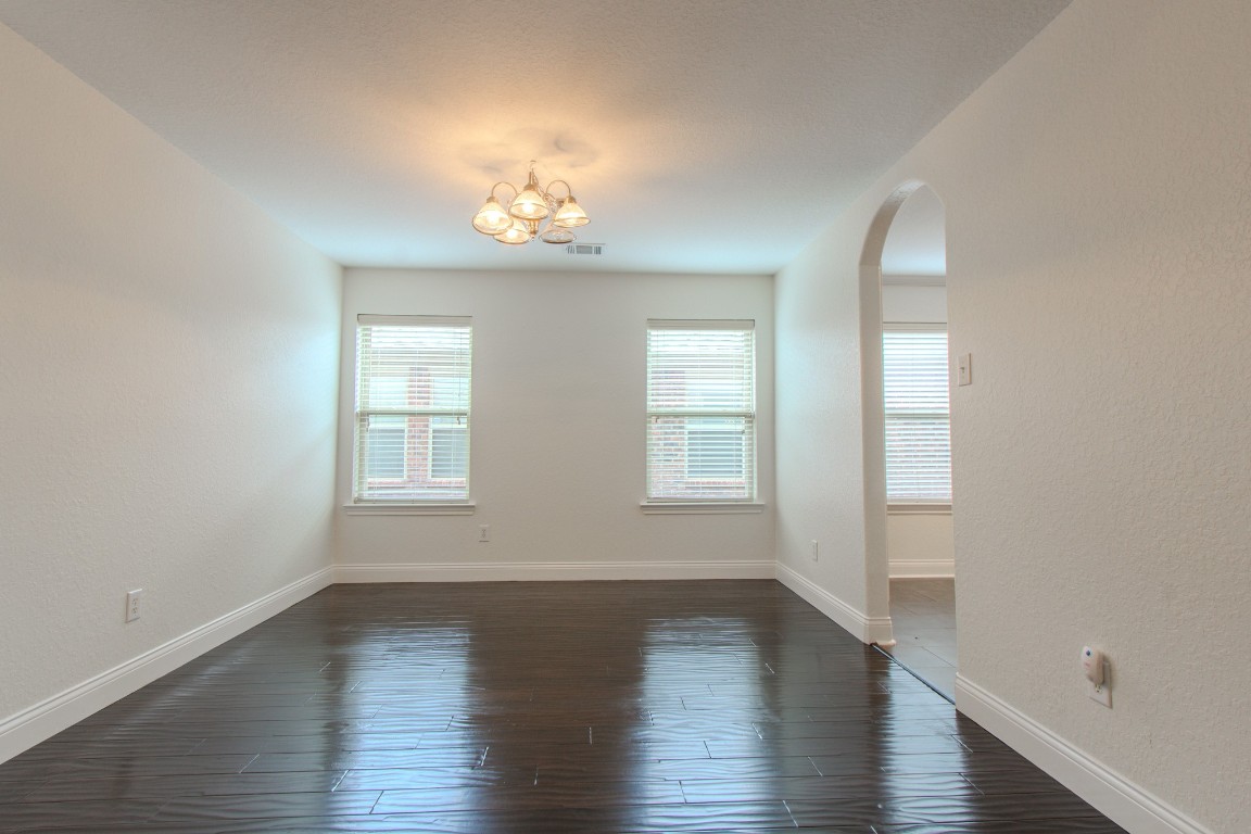 21906 Trapper Lake Drive Spring, TX 77388 - Photo 6 of 21 There are windows incorporated into the dining room while maximizing wall space for furnishings and decor.
