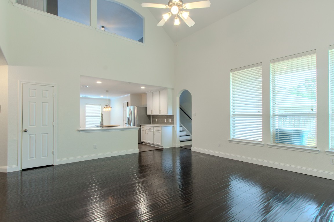 21906 Trapper Lake Drive Spring, TX 77388 - Photo 7 of 21 The soaring ceilings and sunny windows lend to a feeling of even more spaciousness in the greatroom.