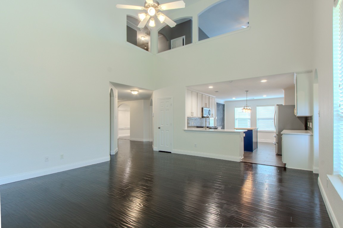 21906 Trapper Lake Drive Spring, TX 77388 - Photo 8 of 21 Noticing how the engineered wood flows throughout and unites the common areas.