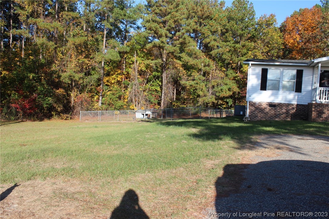 160 Kathleen Road Lillington, NC 27546 - Photo 2 of 5 a view of yard with tree