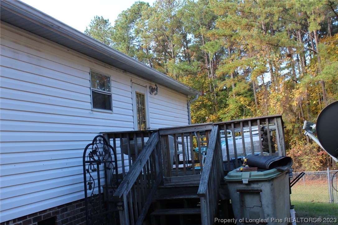 160 Kathleen Road Lillington, NC 27546 - Photo 4 of 5 a view of a balcony with chairs