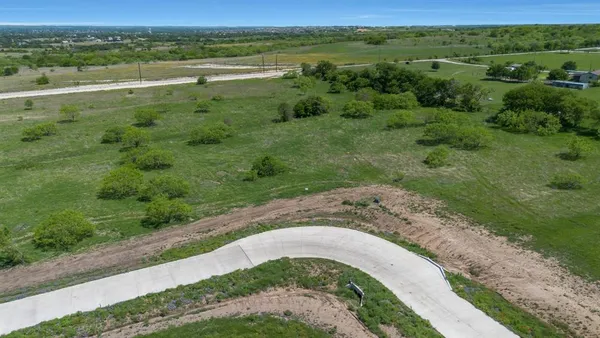a view of a field with an ocean