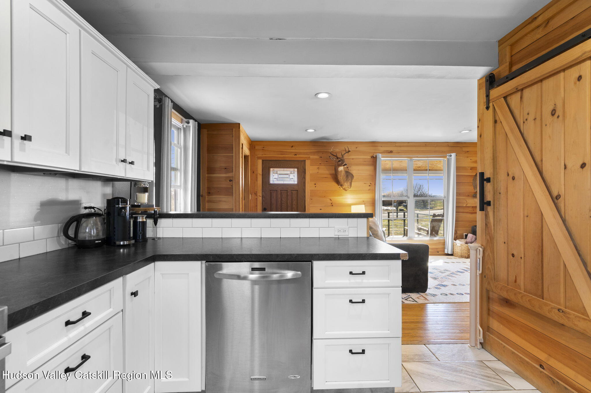 437 Sharptown Road Stuyvesant, NY 12173 - Photo 11 of 39 a kitchen with stainless steel appliances granite countertop a stove a sink and a white cabinets