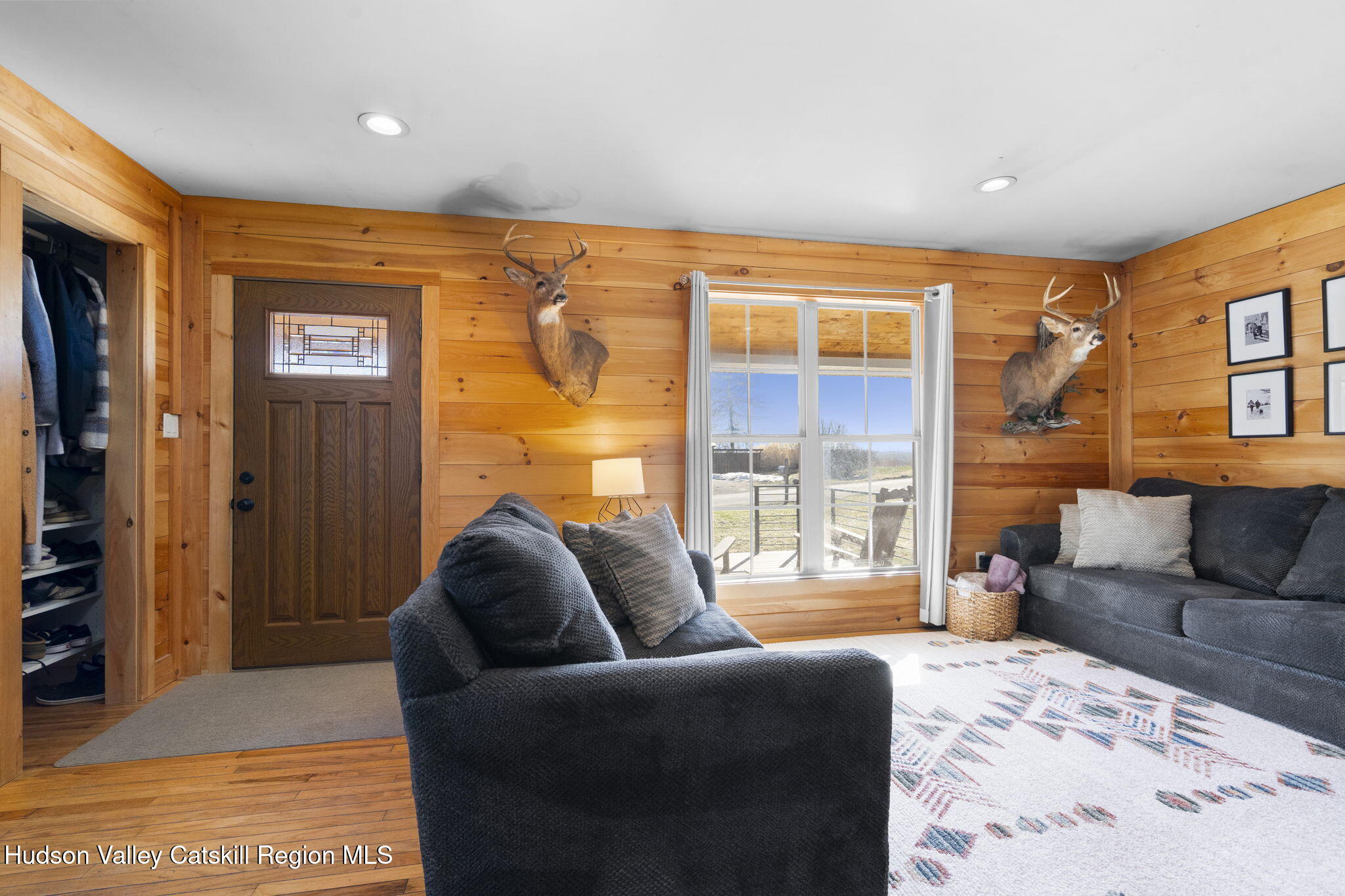 437 Sharptown Road Stuyvesant, NY 12173 - Photo 12 of 39 a living room with furniture and a large window