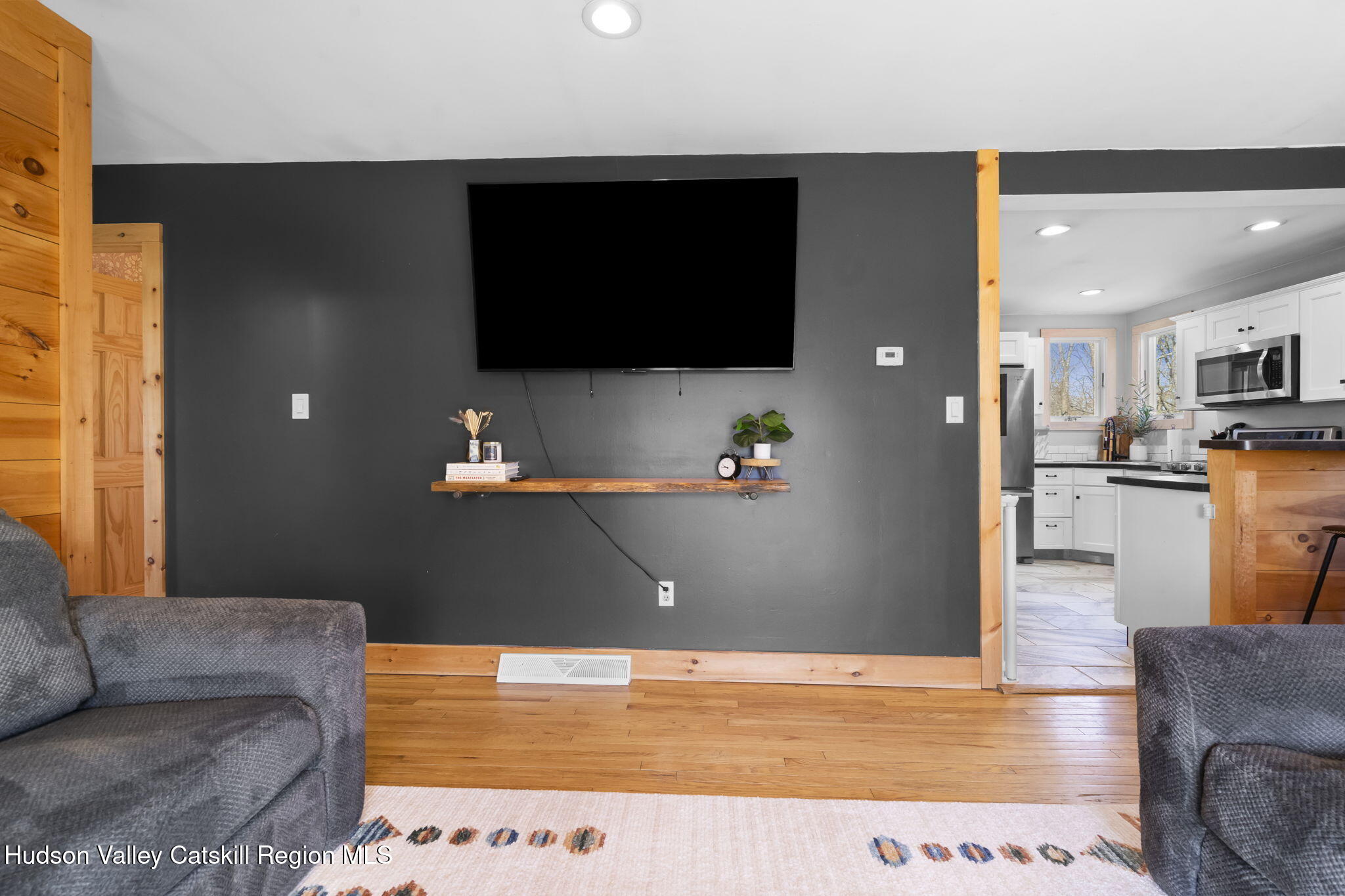 437 Sharptown Road Stuyvesant, NY 12173 - Photo 14 of 39 a living room with furniture and a flat screen tv