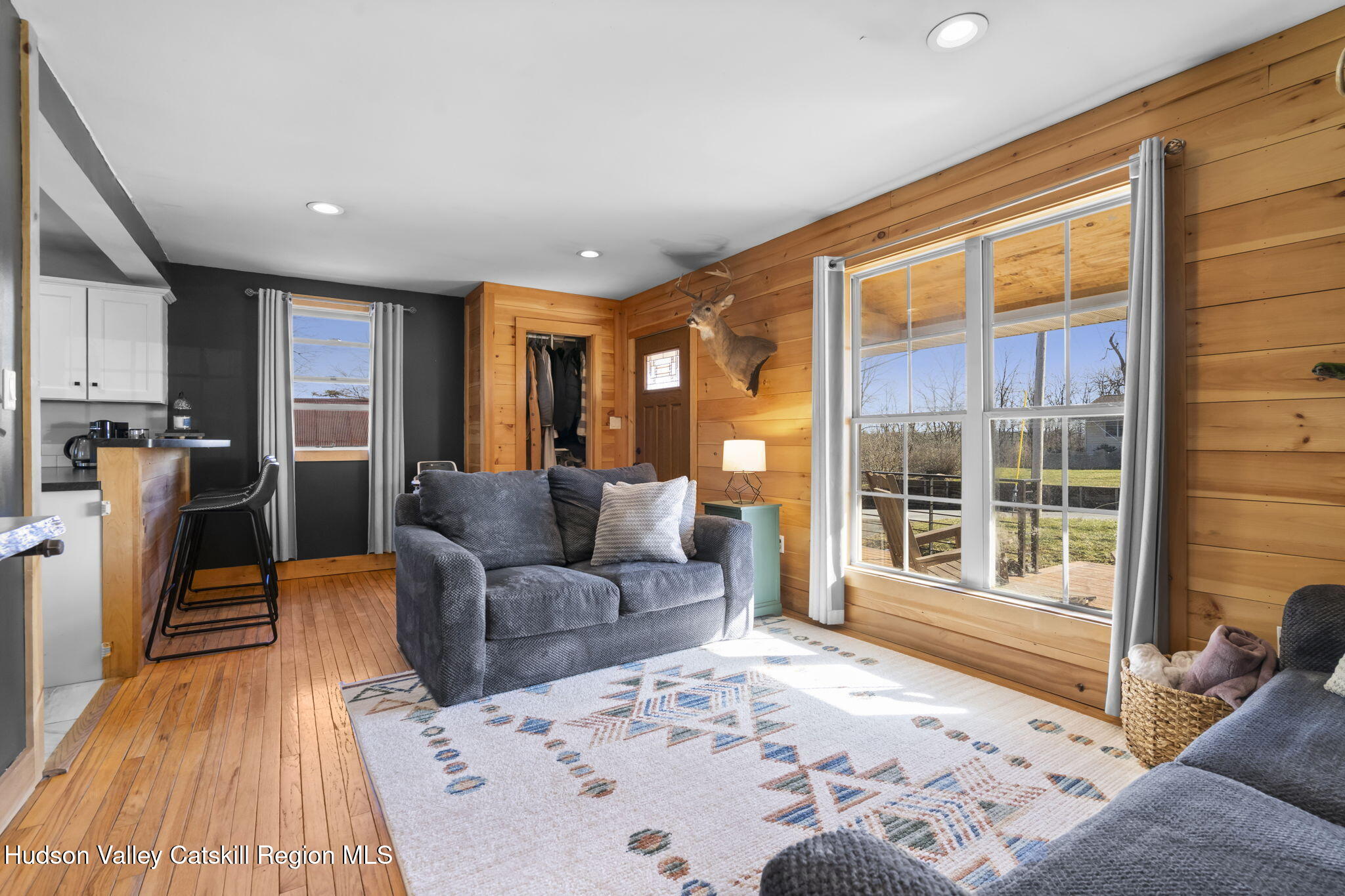 437 Sharptown Road Stuyvesant, NY 12173 - Photo 15 of 39 a living room with furniture and large windows