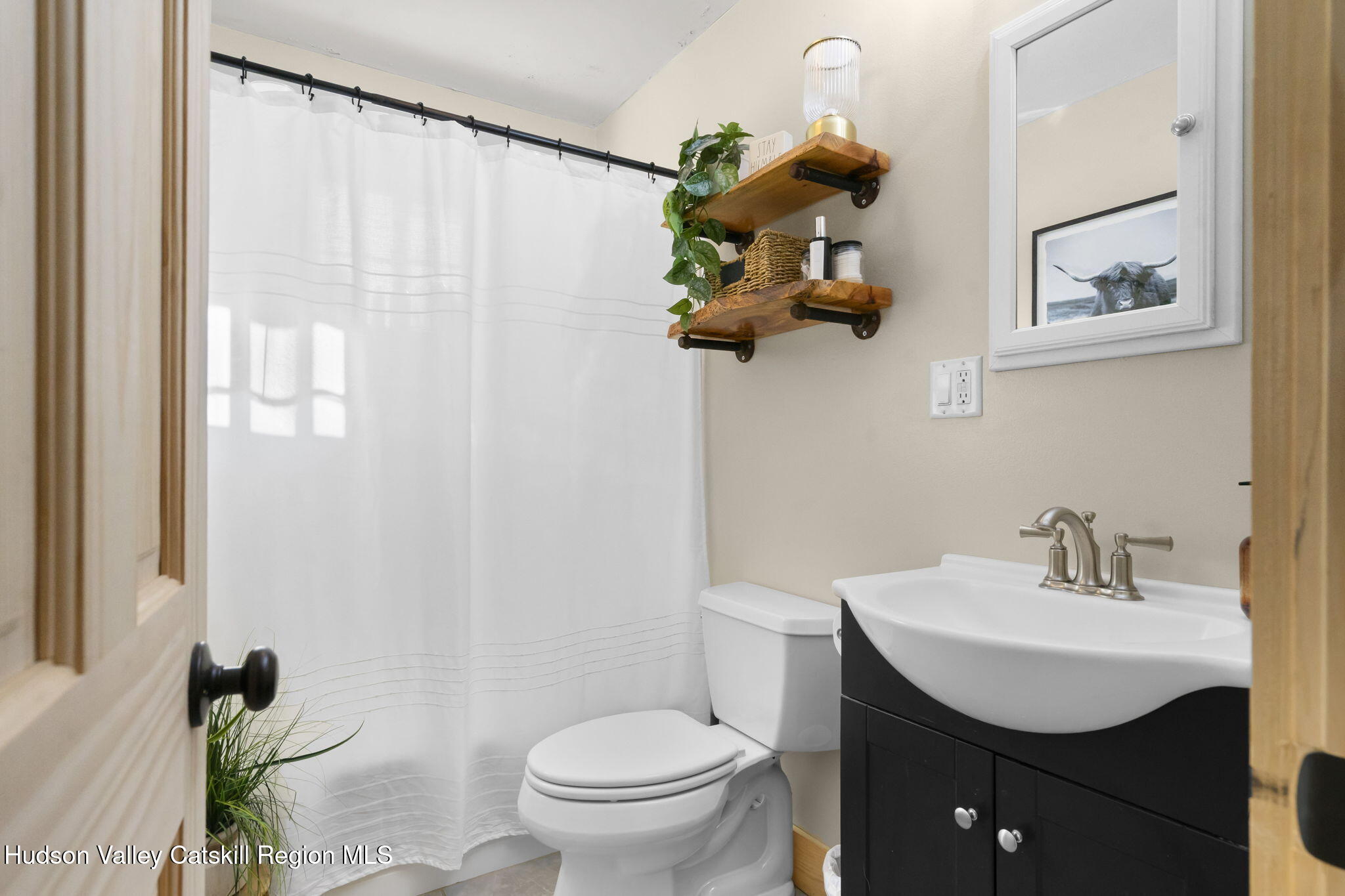 437 Sharptown Road Stuyvesant, NY 12173 - Photo 16 of 39 a bathroom with a toilet a sink and mirror