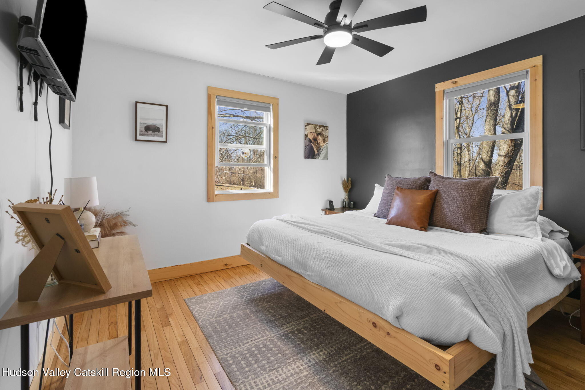 437 Sharptown Road Stuyvesant, NY 12173 - Photo 17 of 39 a bedroom with a bed and wooden floor