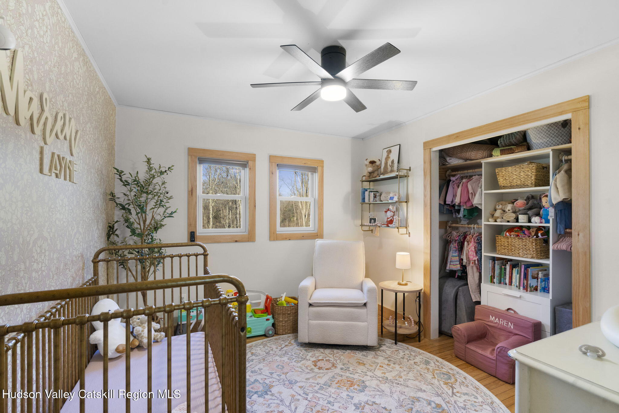437 Sharptown Road Stuyvesant, NY 12173 - Photo 20 of 39 a living room with furniture and a book shelf