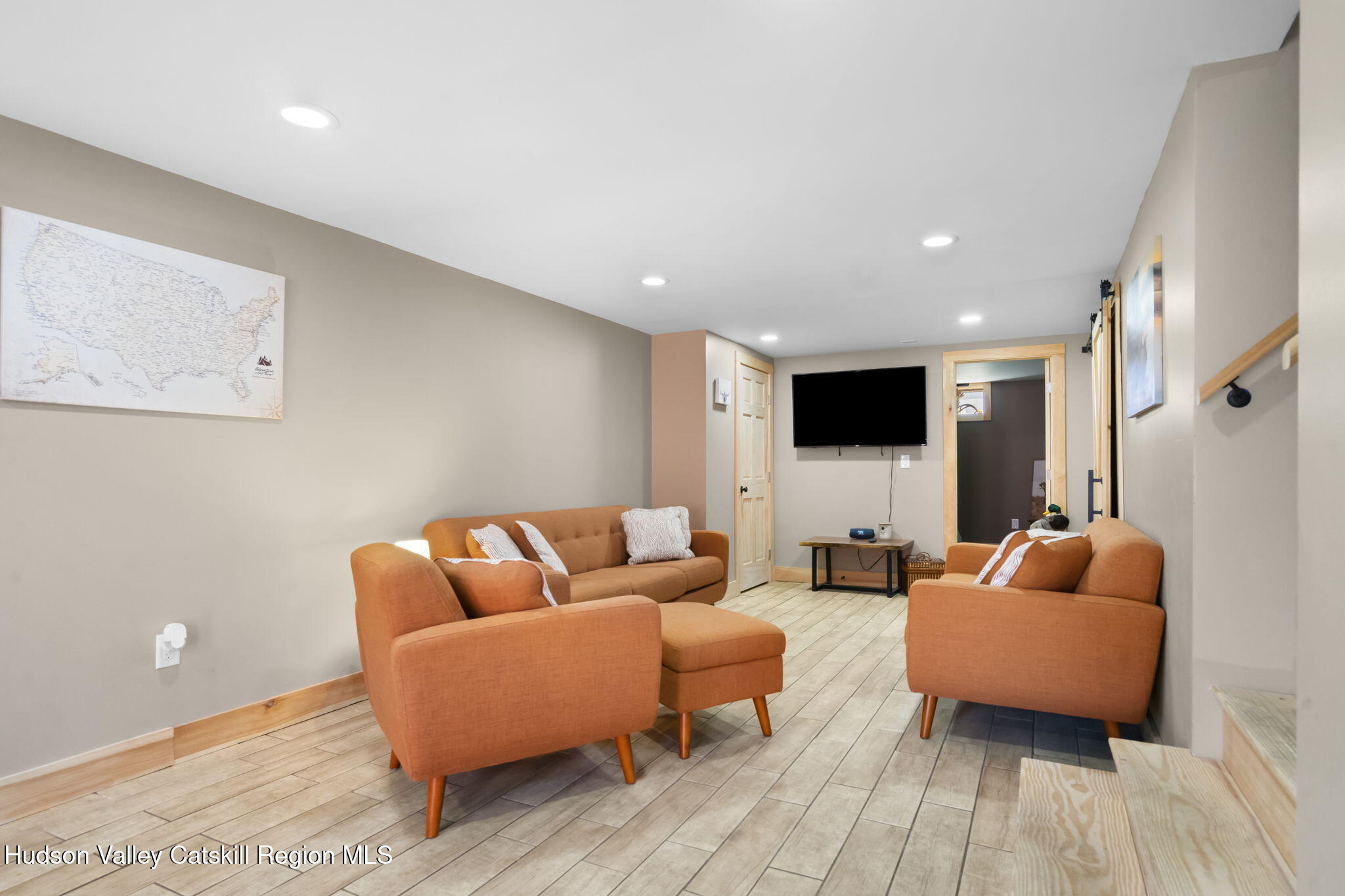 437 Sharptown Road Stuyvesant, NY 12173 - Photo 26 of 39 a living room with furniture and a flat screen tv