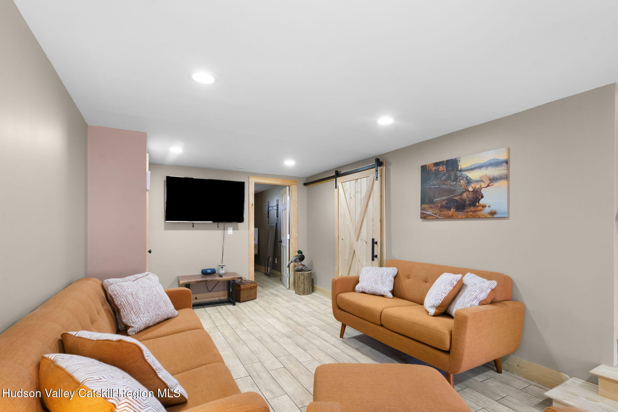 437 Sharptown Road Stuyvesant, NY 12173 - Photo 27 of 39 a living room with furniture and a flat screen tv