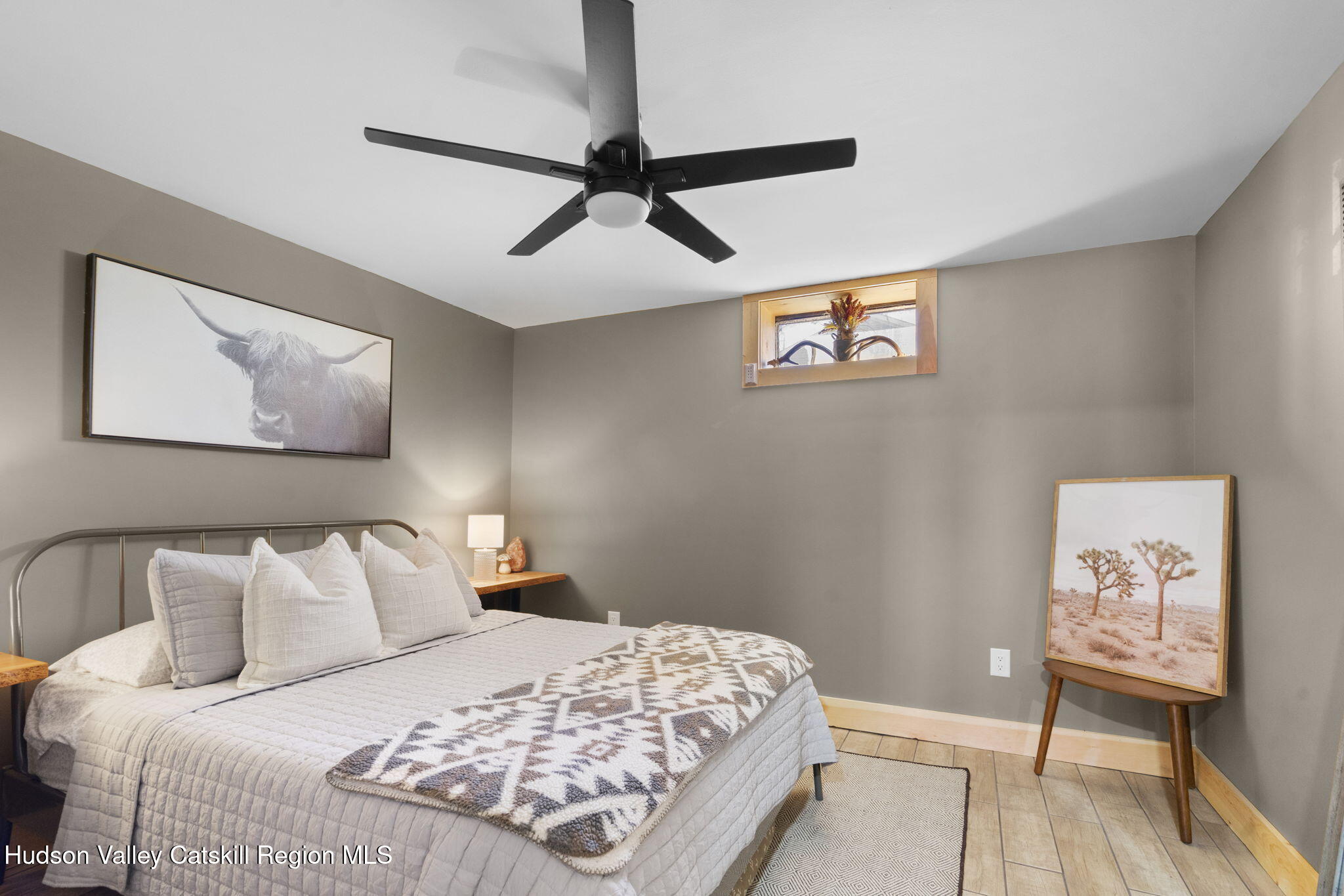 437 Sharptown Road Stuyvesant, NY 12173 - Photo 29 of 39 a bedroom with a bed and a painting on the wall