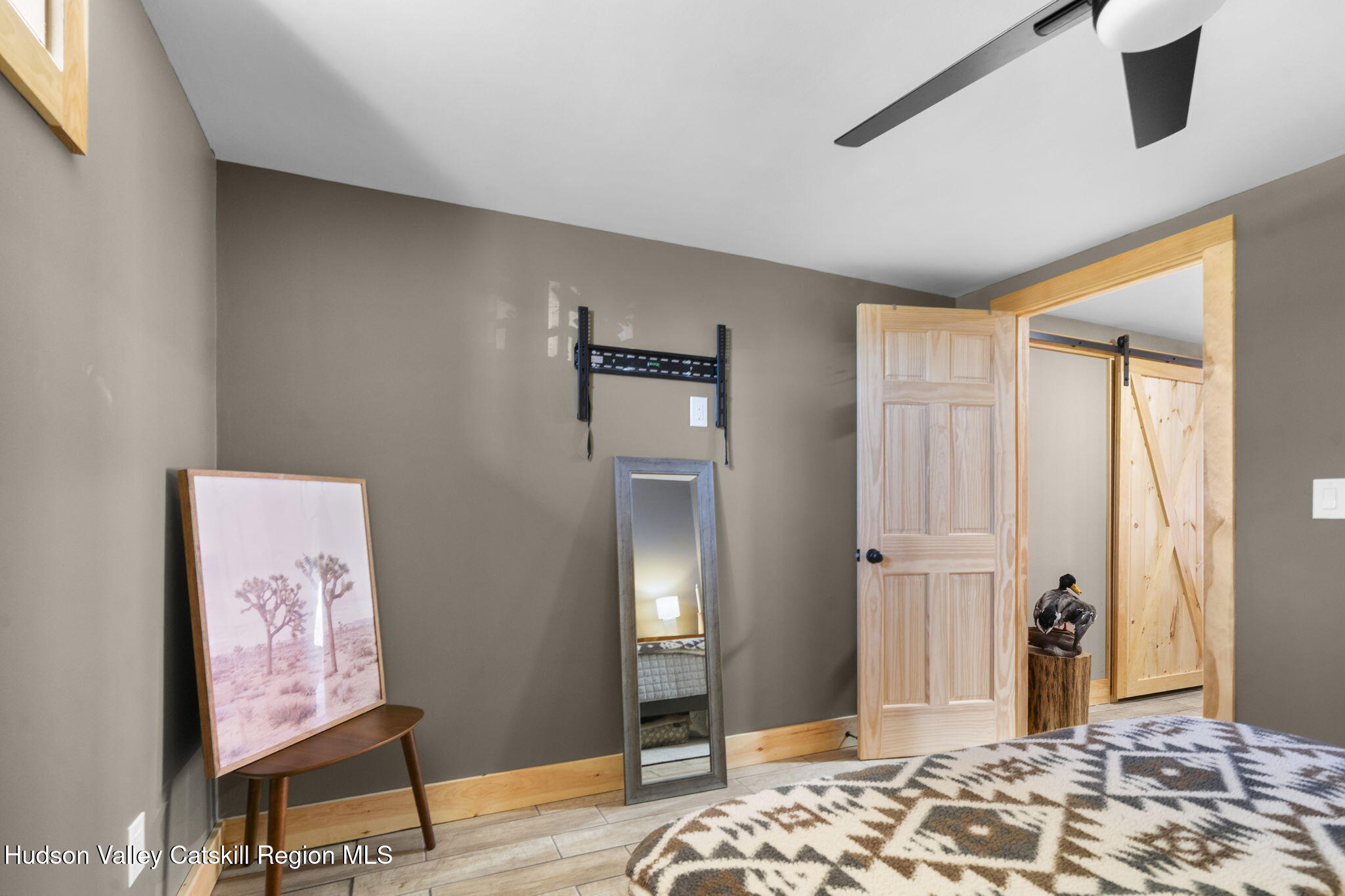 437 Sharptown Road Stuyvesant, NY 12173 - Photo 30 of 39 a bedroom with a bed and wooden floor