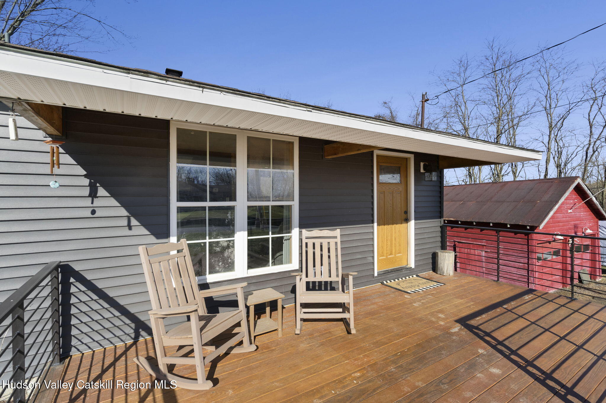 437 Sharptown Road Stuyvesant, NY 12173 - Photo 5 of 39 a front view of a house with a balcony