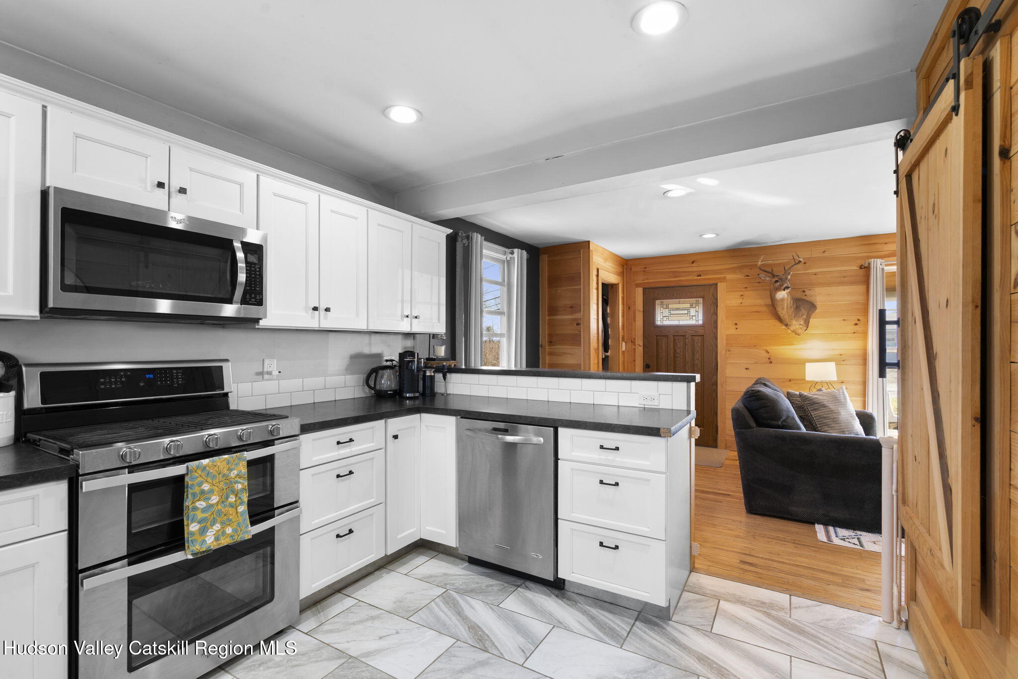 437 Sharptown Road Stuyvesant, NY 12173 - Photo 8 of 39 a kitchen with granite countertop white cabinets and stainless steel appliances
