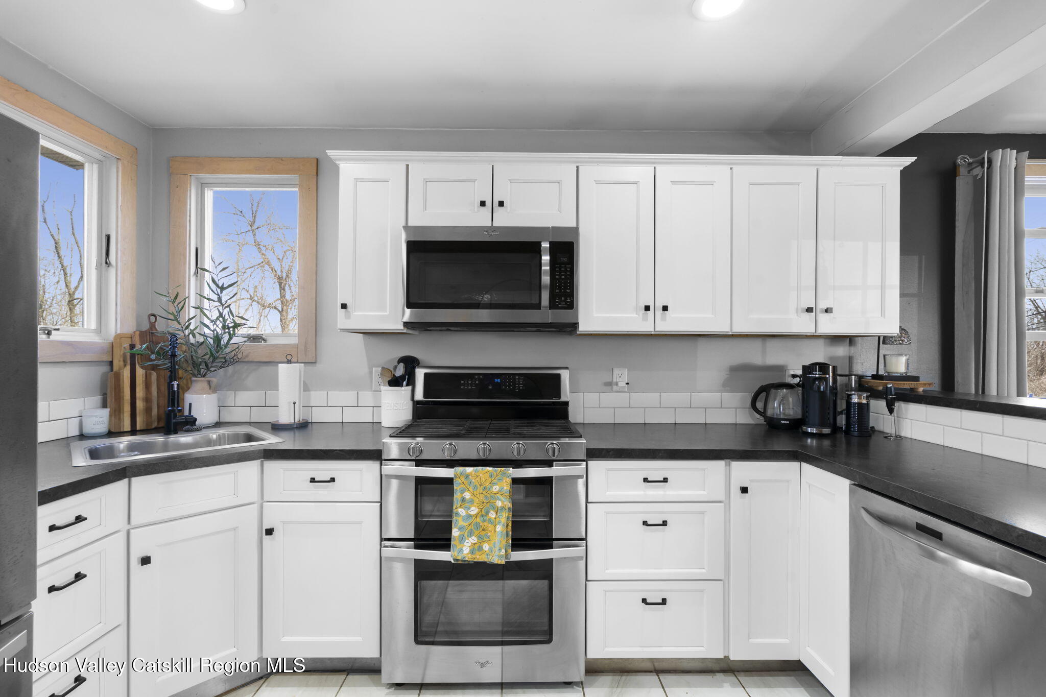 437 Sharptown Road Stuyvesant, NY 12173 - Photo 9 of 39 a kitchen with granite countertop white cabinets white stainless steel appliances and a sink