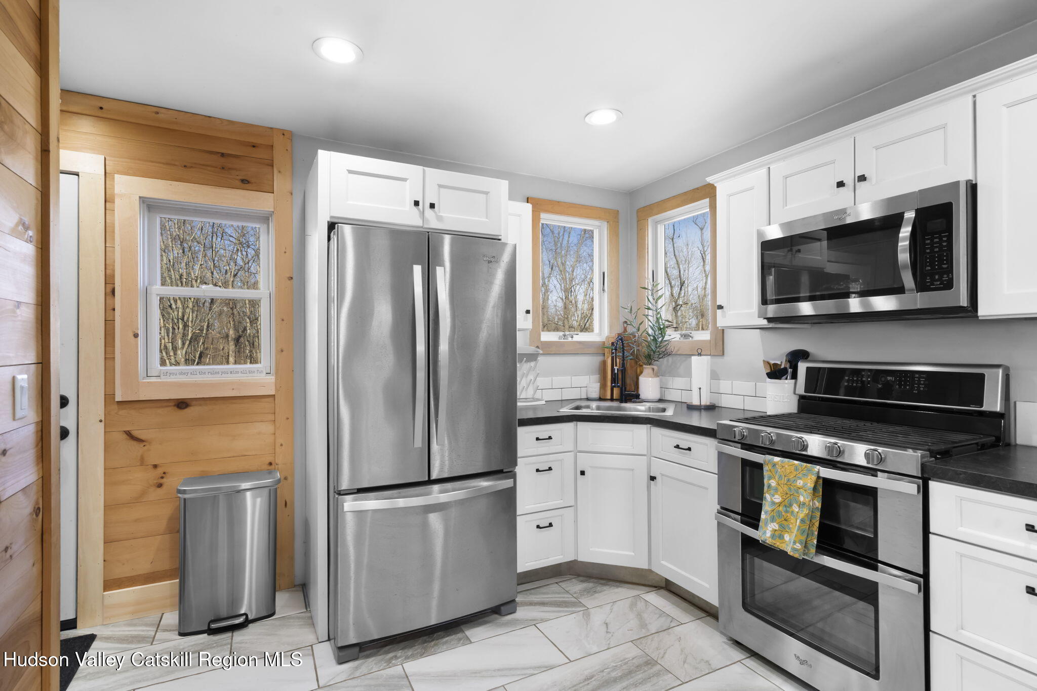 437 Sharptown Road Stuyvesant, NY 12173 - Photo 10 of 39 a kitchen with stainless steel appliances a refrigerator stove and microwave