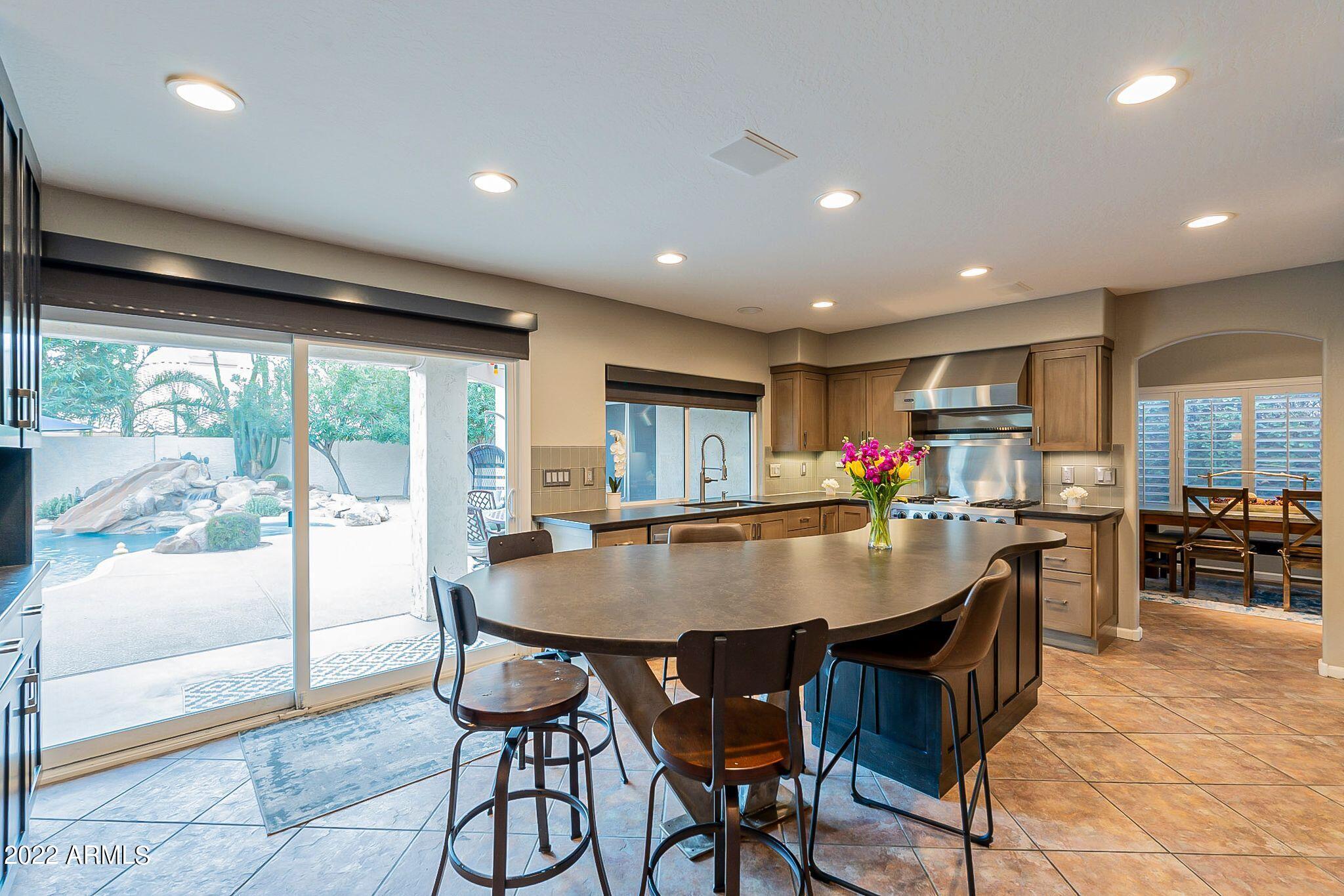 3425 East Clark Road Phoenix, AZ 85050 - Photo 14 of 59 Kitchen + Outdoor View